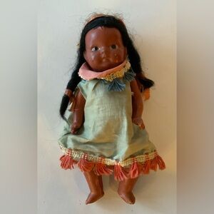 Charming Doll with Green Dress and Pink Accents